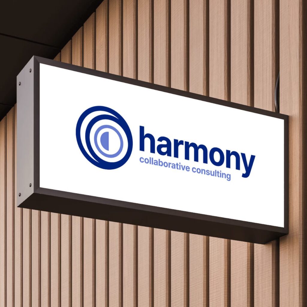 Building sign with Harmony Collaborative Consulting logo on it